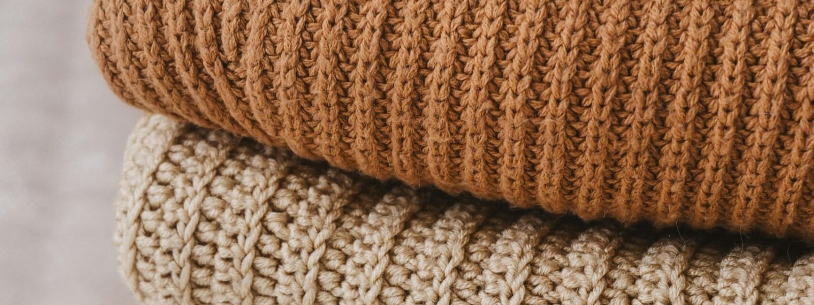 Folded knitwear in natural shades, from the OCI media library