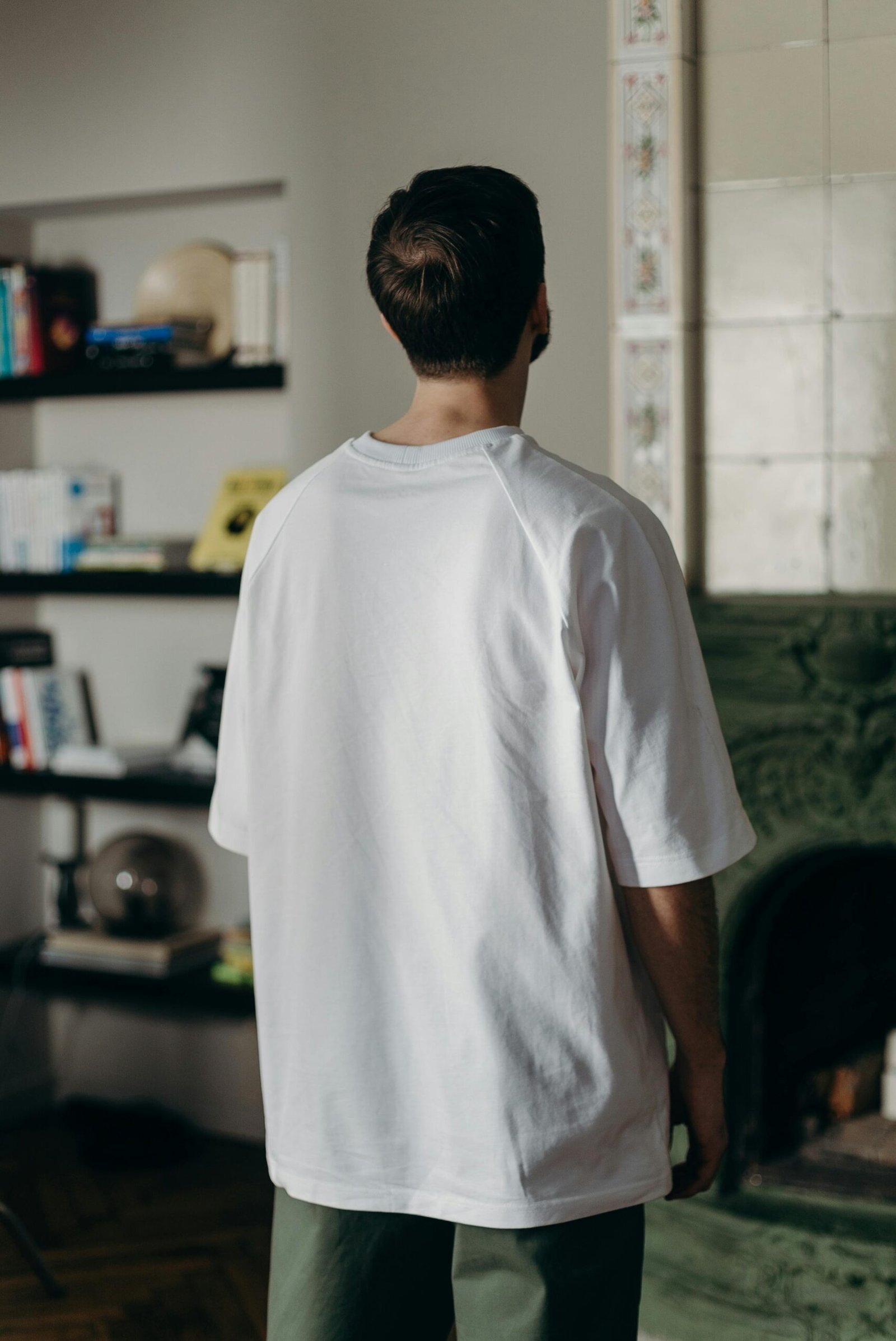 White organic T-shirt worn from the back