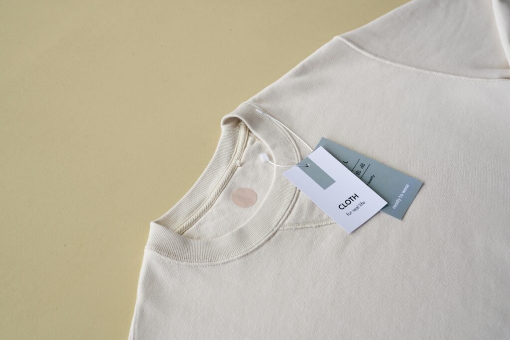Cream cotton T-shirt and fabric labels, from the OCI media library
